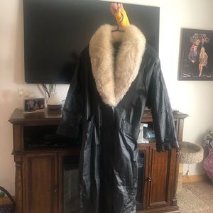 Black leather coat with faux fur.